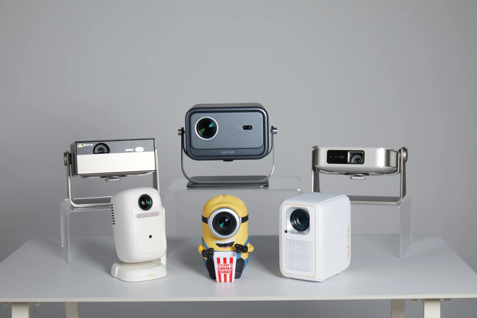 Product and model photography for O.B.E projectors, covering clean product shots, multi-model line-ups, and lifestyle interaction.
