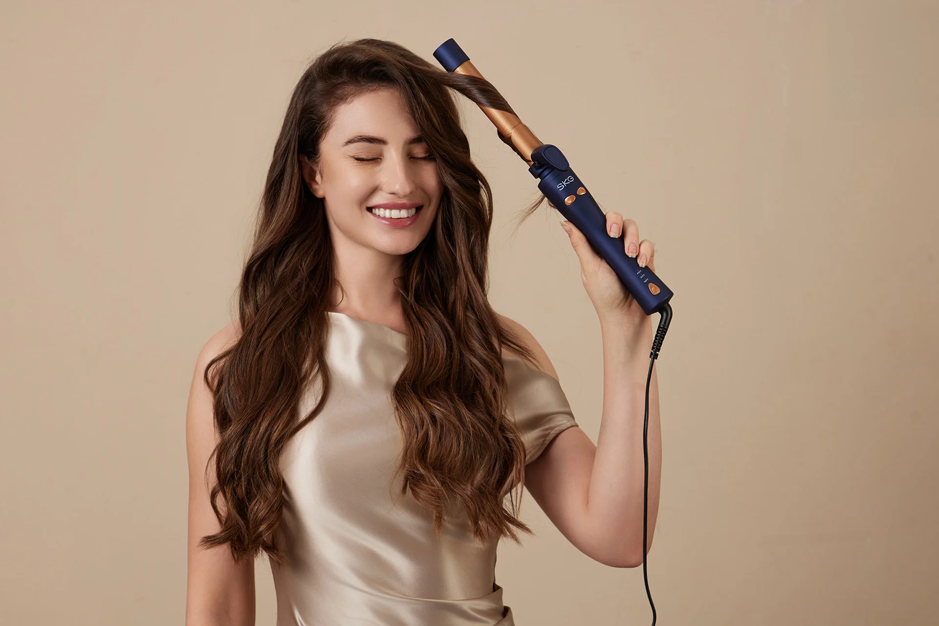 Commercial product photography for the SKG curling iron, featuring lifestyle models, hair styling demonstrations, and visible curling results. Created for curling iron photography, hair styling tool campaigns, beauty appliance advertising, and e-commerce content.